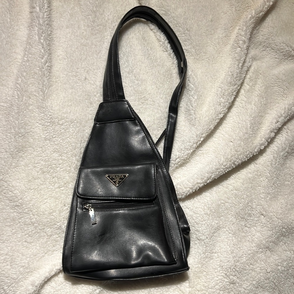 Knock off Prada over the shoulder or backpack purse.